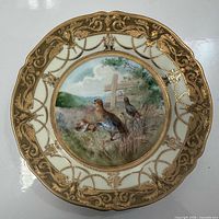 Full view of plate showing quail scene and gilt moriage border