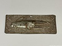 Front view of embossed car tama plaque