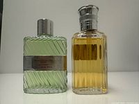 Front view of both 50 ml bottles displaying liquid levels and ribbed design
