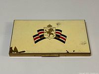 Closed case top view showing enamel crest and wear at edges