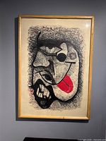 Front view of framed abstract portrait artwork