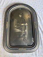 Full view of convex glass frame and photograph