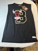 Full view of black sleeveless Chicago Bulls tee showing graphics and patch