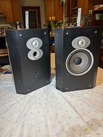 Front view of both Polk Audio FXi5 speakers showing drivers and ports