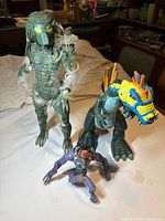 Group shot of all three action figures on table