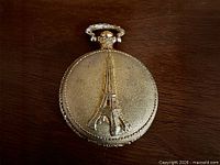 Front cover showing raised Eiffel Tower design