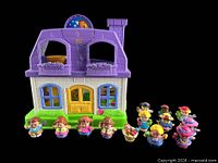 Front view of playhouse with 13 figures lined up