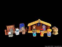 Full playset layout showing stable, figures, animals and accessories