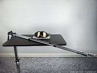 Walking poles and goggles on table