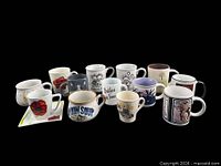 Front view showing all 14 mugs and saucer
