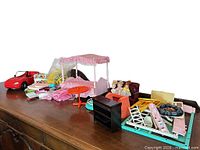 Overall lot on dresser showing car, bed, table, sofa, accessories