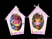 Front view of both boxed Kelly line Chick Poussin dolls