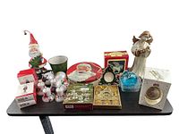 Group shot of approximately 20 Christmas décor items on table