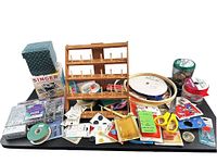 Overview of entire lot including spool rack, ribbons, hoops, jar of buttons, Singer cube box, bead kits, assorted notion cards