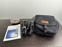 Accessories: manual, charger, power cord, camera case