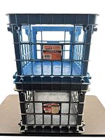 Front view showing stacked blue over black crates with Staples labels