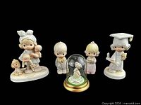 Group shot of all five Precious Moments figurines