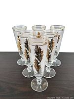 Six matching stemmed glasses grouped on tabletop