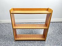 Front view of small three-shelf bookcase