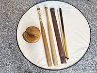 All items: mitt, two bats, cue parts, fabric sleeve