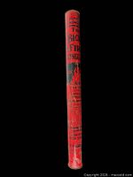 Full view of red cylindrical fire extinguisher tube