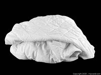 Folded white quilted mattress pad shows overall item