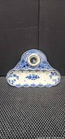 Front view of Delft blue inkstand tray with inkwell in place