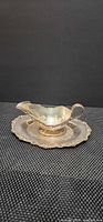 Gravy boat seated on underplate, full view of set