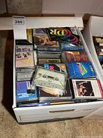 Top view of box showing mix of music and blank cassettes