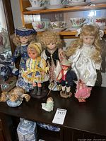 Group shot of all eight dolls on shelf
