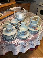 Full grouping of plates, bowls, cups, serving pieces