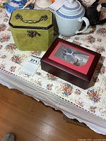 Both jewelry boxes closed on table