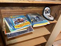 Shelf view with phone book, magazines, patch case