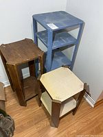 All three wooden stands grouped together