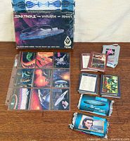 Overall lot showing boxed miniatures, plastic sheet with cards, sealed packs and loose bundles