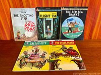 Overview of all five comic graphic novels laid out showing covers