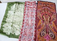 All three scarves laid out together