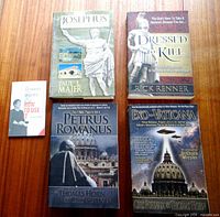 Group shot of all five publications arranged on wooden surface