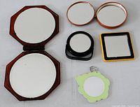 All five mirrors open to show reflective surfaces