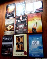 All ten titles arranged on wood surface