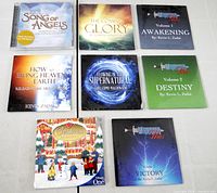 Eight shrink-wrapped CDs laid out for overview