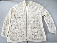 Full view of cream crochet cardigan front