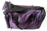 Front view showing color, handles, shoulder strap, front pocket