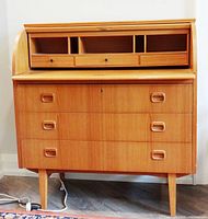 Desk front with roll-top open, organizer visible, drawers closed