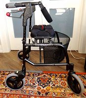 Full side view of Nexus rollator showing seat, basket and wheels