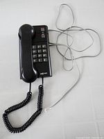 Full view of Northern Telecom Jazz phone with handset on base and cords visible