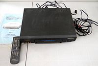 Top view of Panasonic PV-4562-K VCR with remote, manual and cable bundle