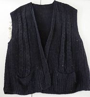 front view of dark blue knitted vest showing overall design and pockets