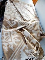 Blanket draped showing overall fabric and fringe