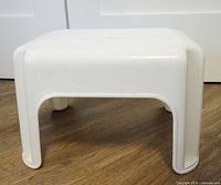 white plastic step stool front/side view